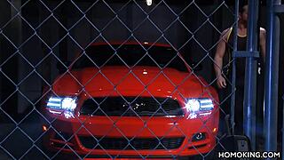 Muscular men have hot gay sex on the roof of a red car