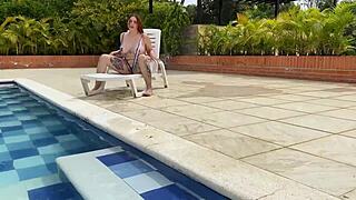 Naughty redhead Andy Rose rides big cock by the pool!