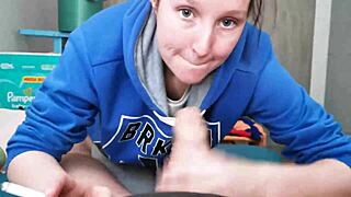 Brunette in hoodie sucks cock for a mouthful